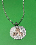 Handmade Sterling Silver pendant with copper Triskele. Choice of 18 or 20 inch chain
