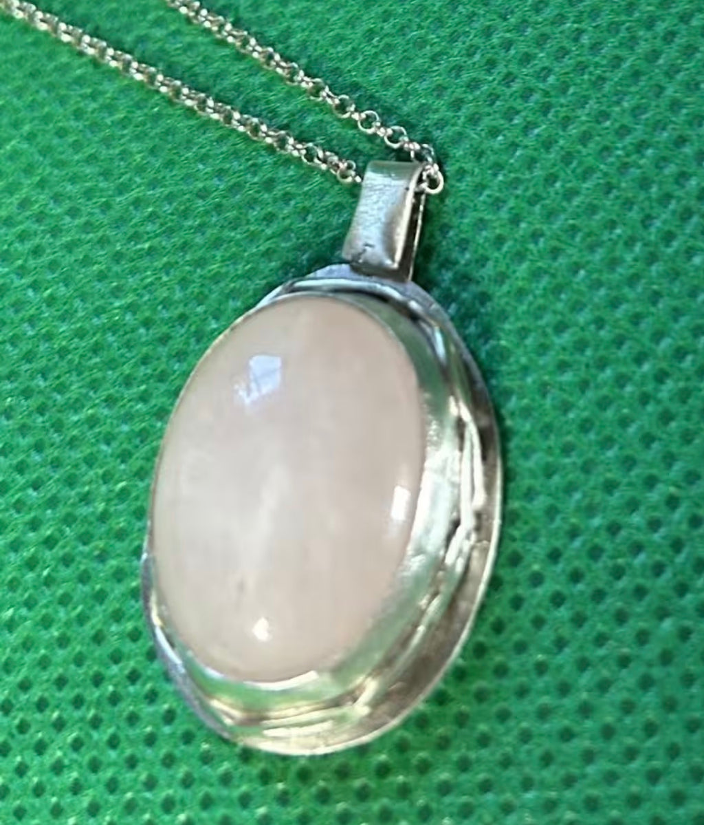 Handmade sterling silver and rose quartz stone pendant on an 18 inch necklace