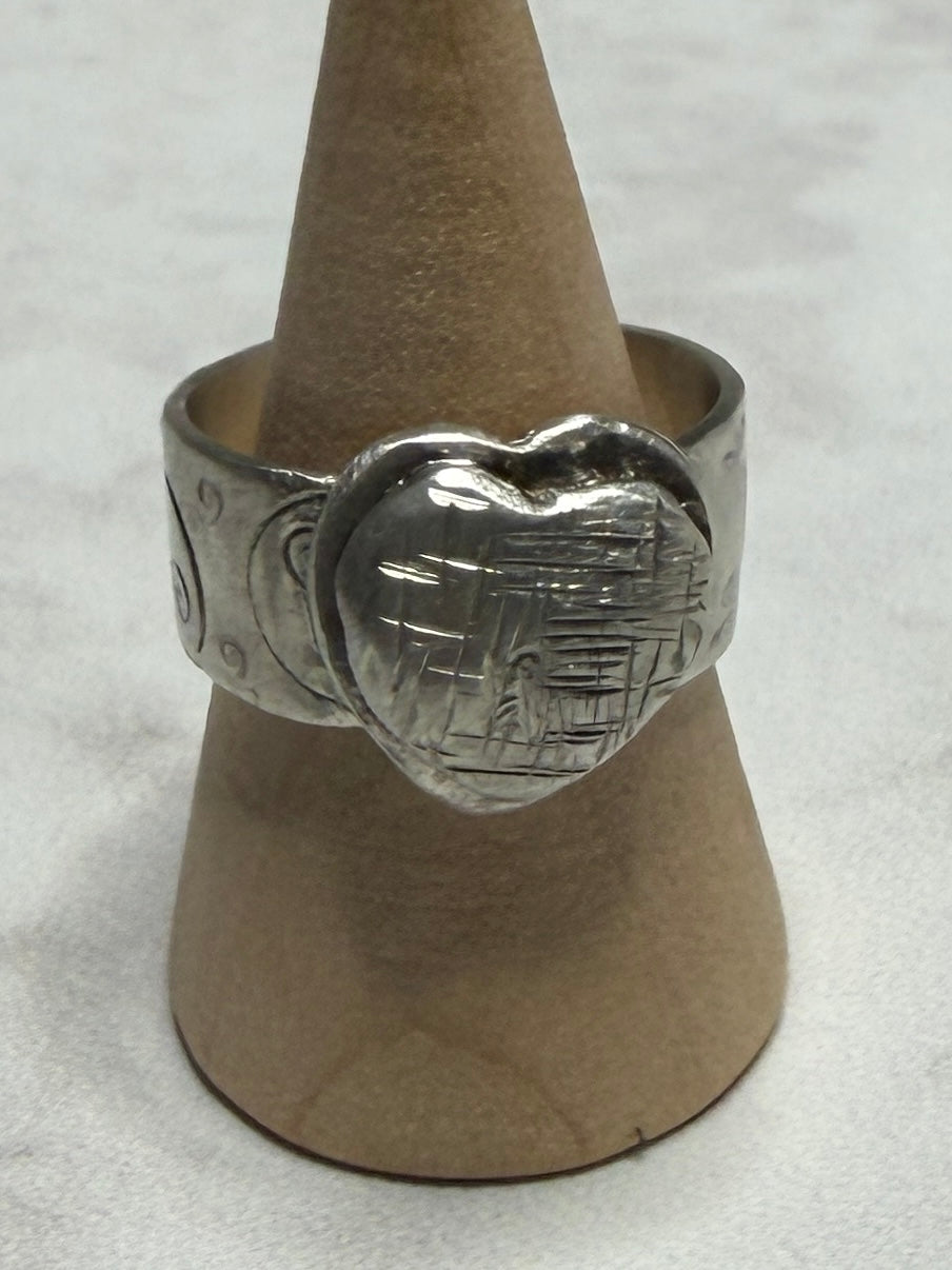 Handmade sterling silver with Triskele and love heart. Thick band, size R