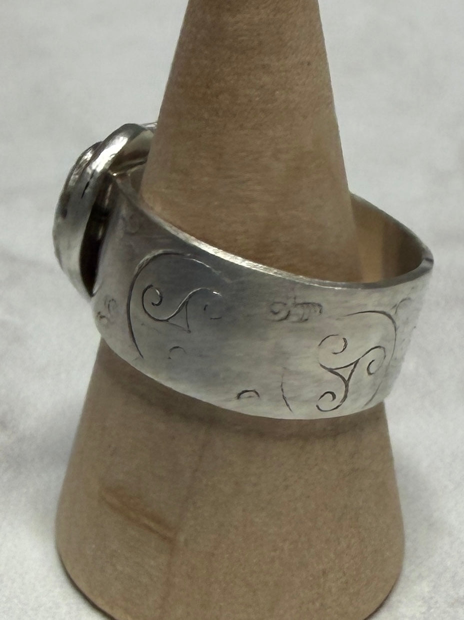 Handmade sterling silver with Triskele and love heart. Thick band, size R