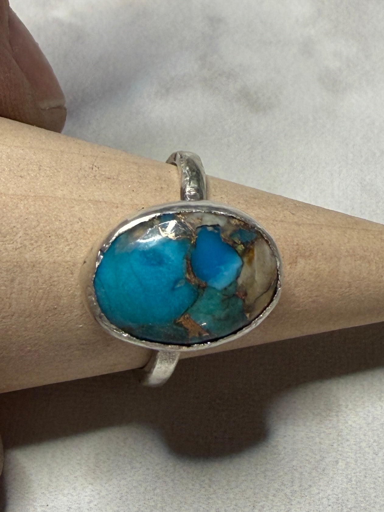 Handmade sterling silver ring with turquoise stone. Size O