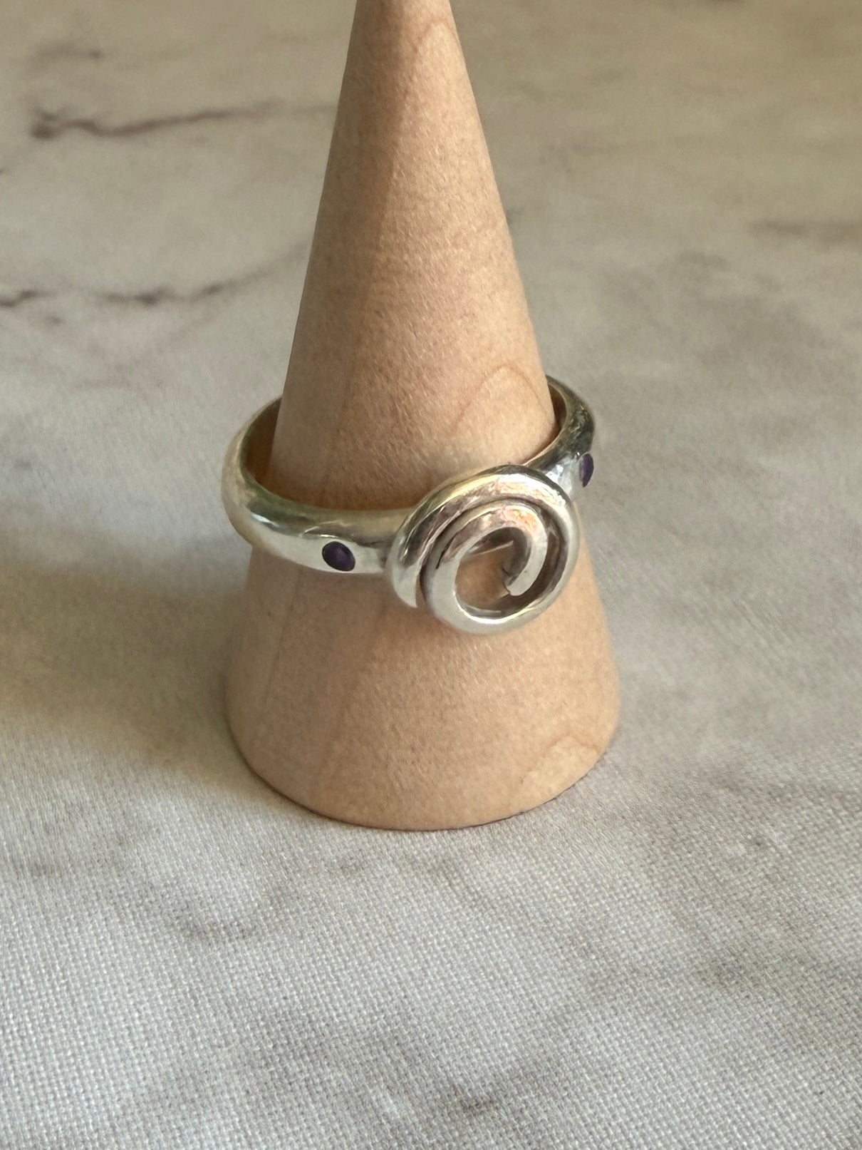 Handmade sterling silver Celtic swirl with purple flush set CZ stones