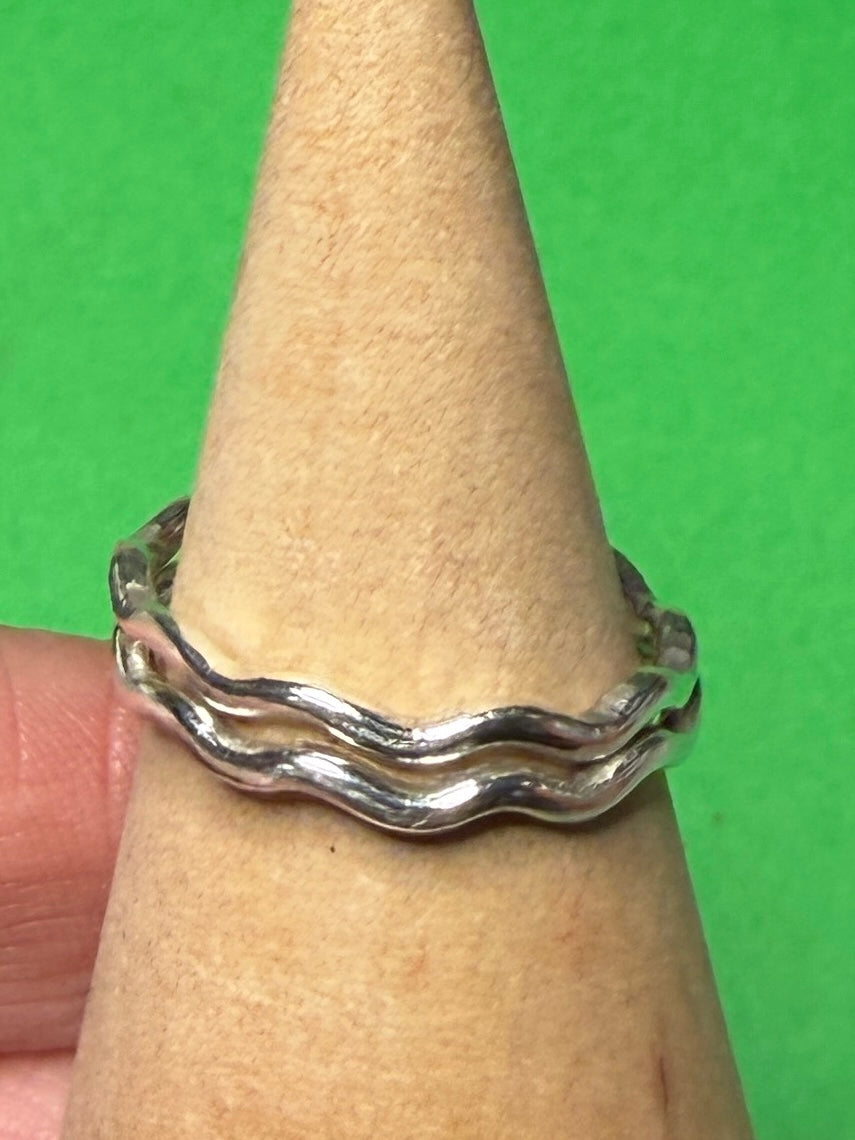 Handmade sterling silver wave ring. Two rings together.