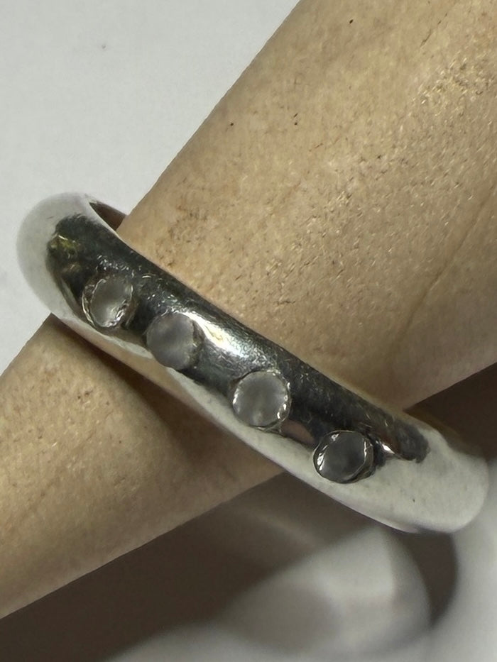 Handmade sterling silver ring with flush set stones. White stones. Size N