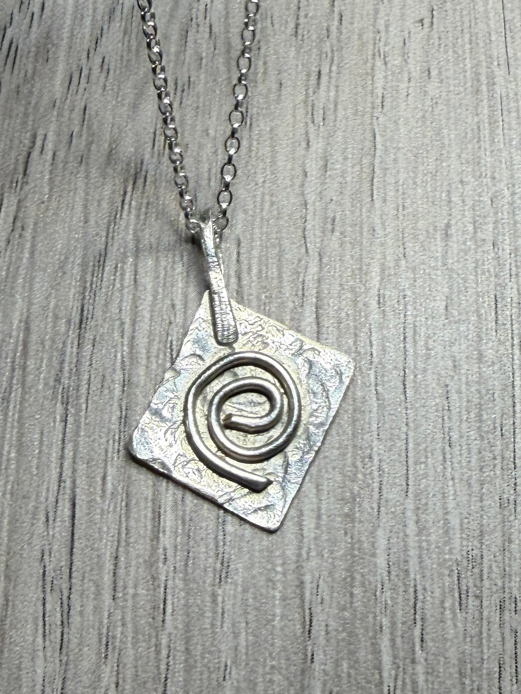 Handmade sterling silver Celtic swirl pendant on 20inch chain.