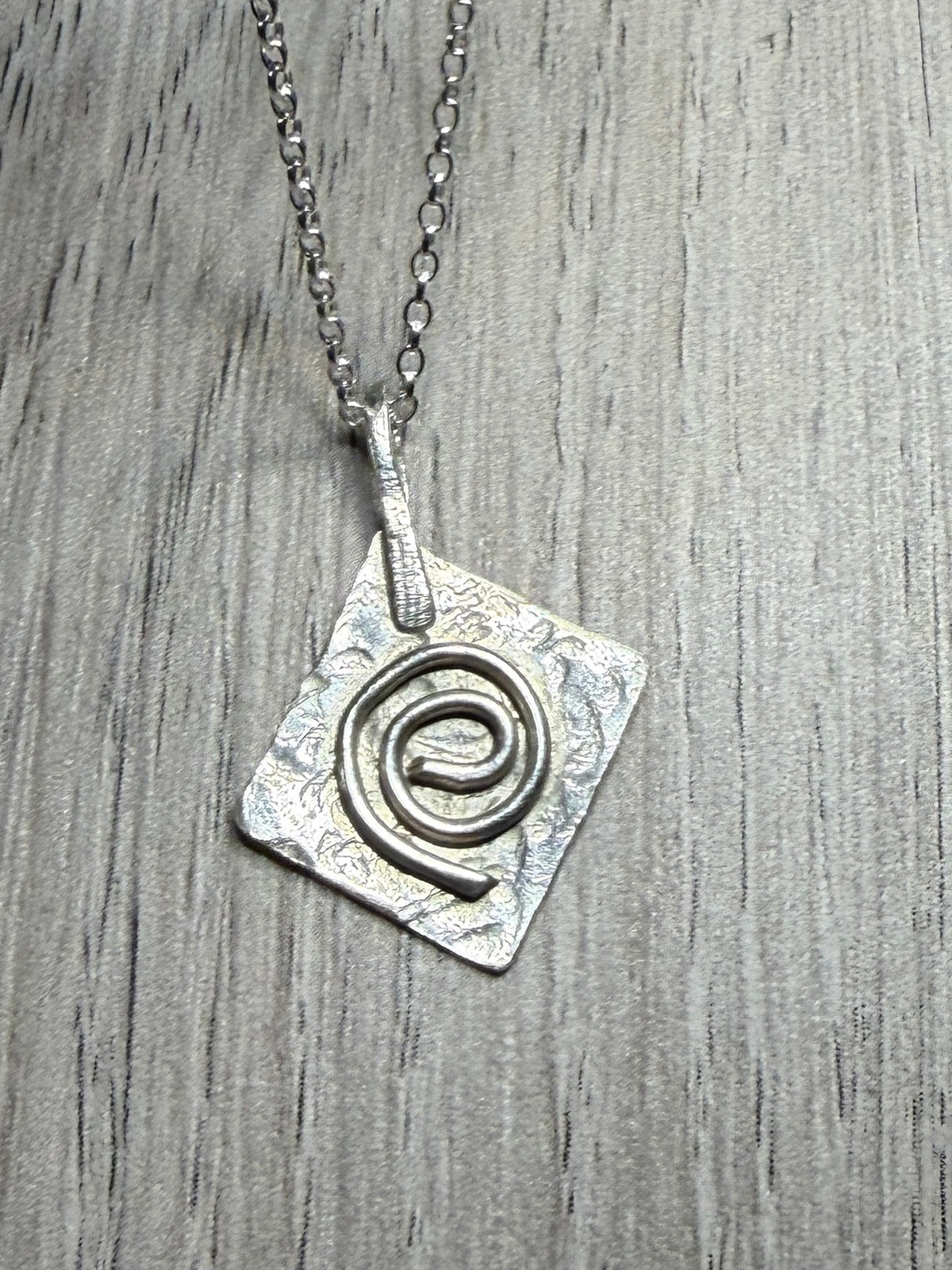 Handmade sterling silver Celtic swirl pendant on 20inch chain.