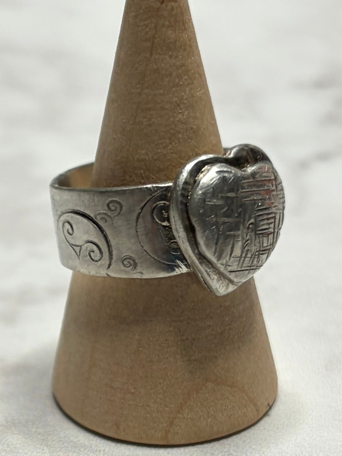 Handmade sterling silver with Triskele and love heart. Thick band, size R