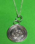 Handmade silver triskele pendant on an 18 inch necklace