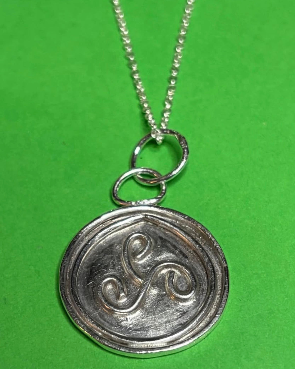 Handmade silver triskele pendant on an 18 inch necklace