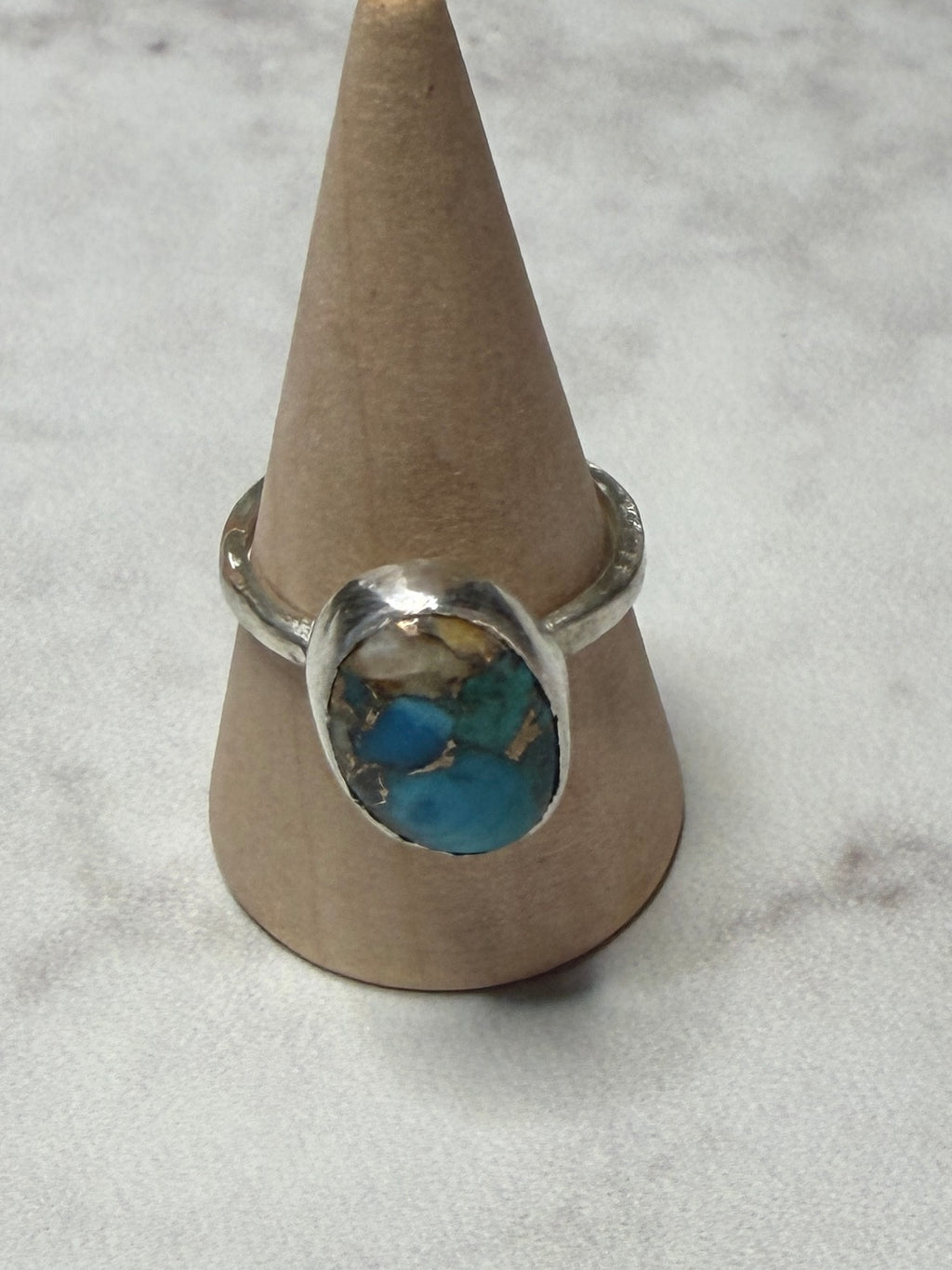 Handmade sterling silver ring with turquoise stone. Size O