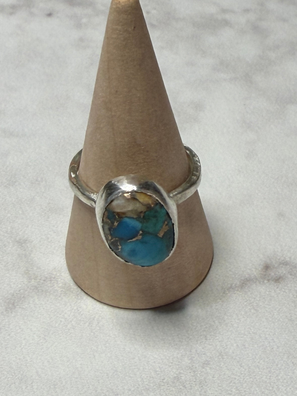 Handmade sterling silver ring with turquoise stone. Size O