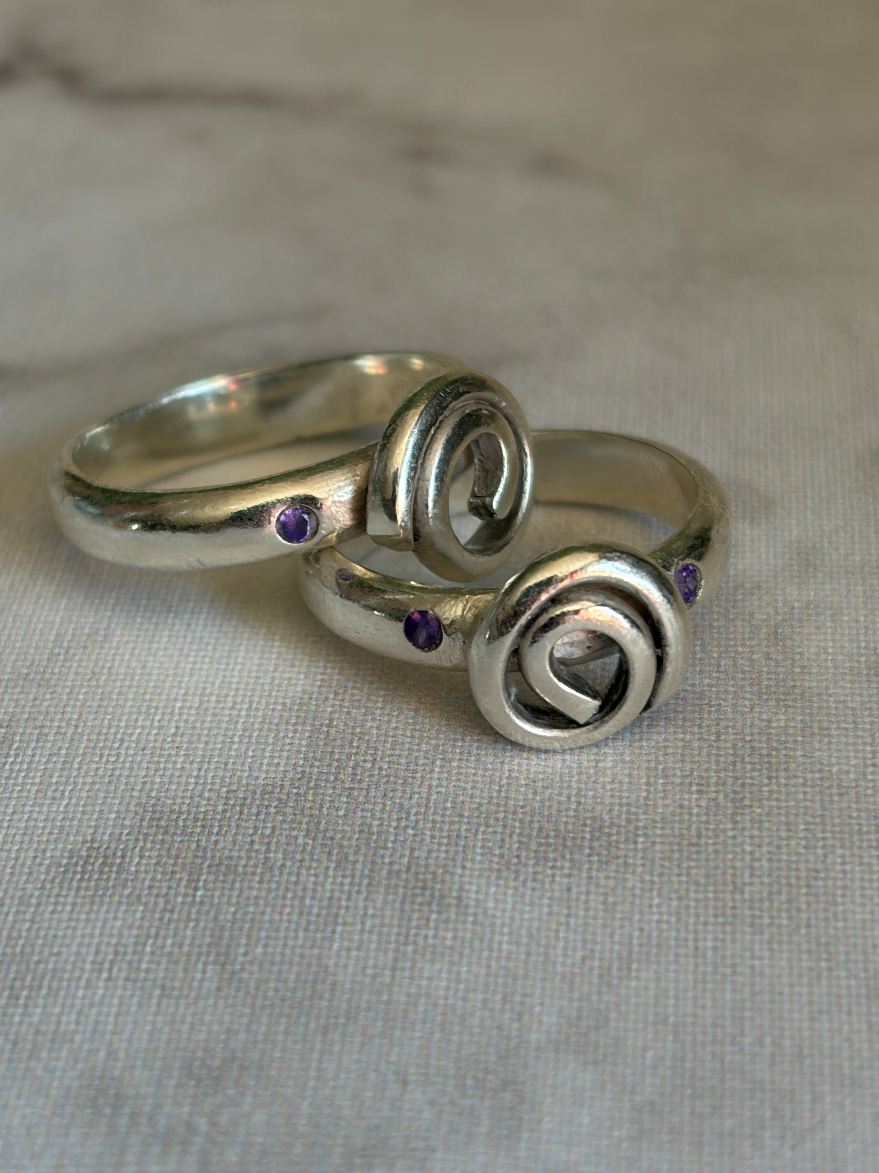 Handmade sterling silver Celtic swirl with purple flush set CZ stones