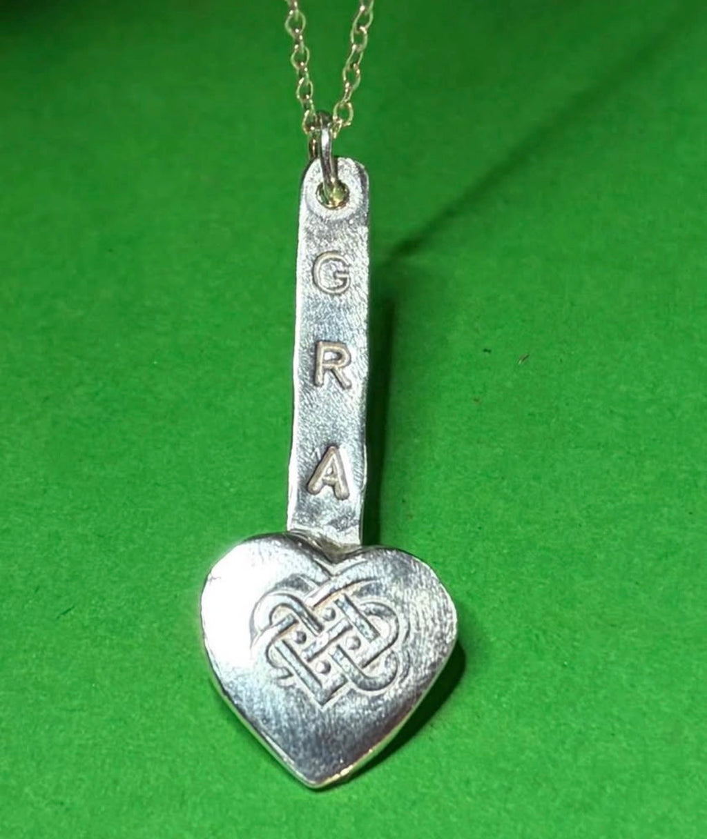 Handmade sterling silver love heart gra pendant on 18inch necklace.