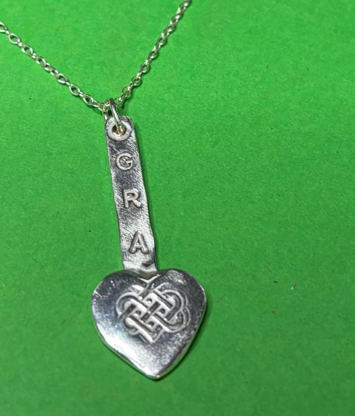 Handmade sterling silver love heart gra pendant on 18inch necklace.